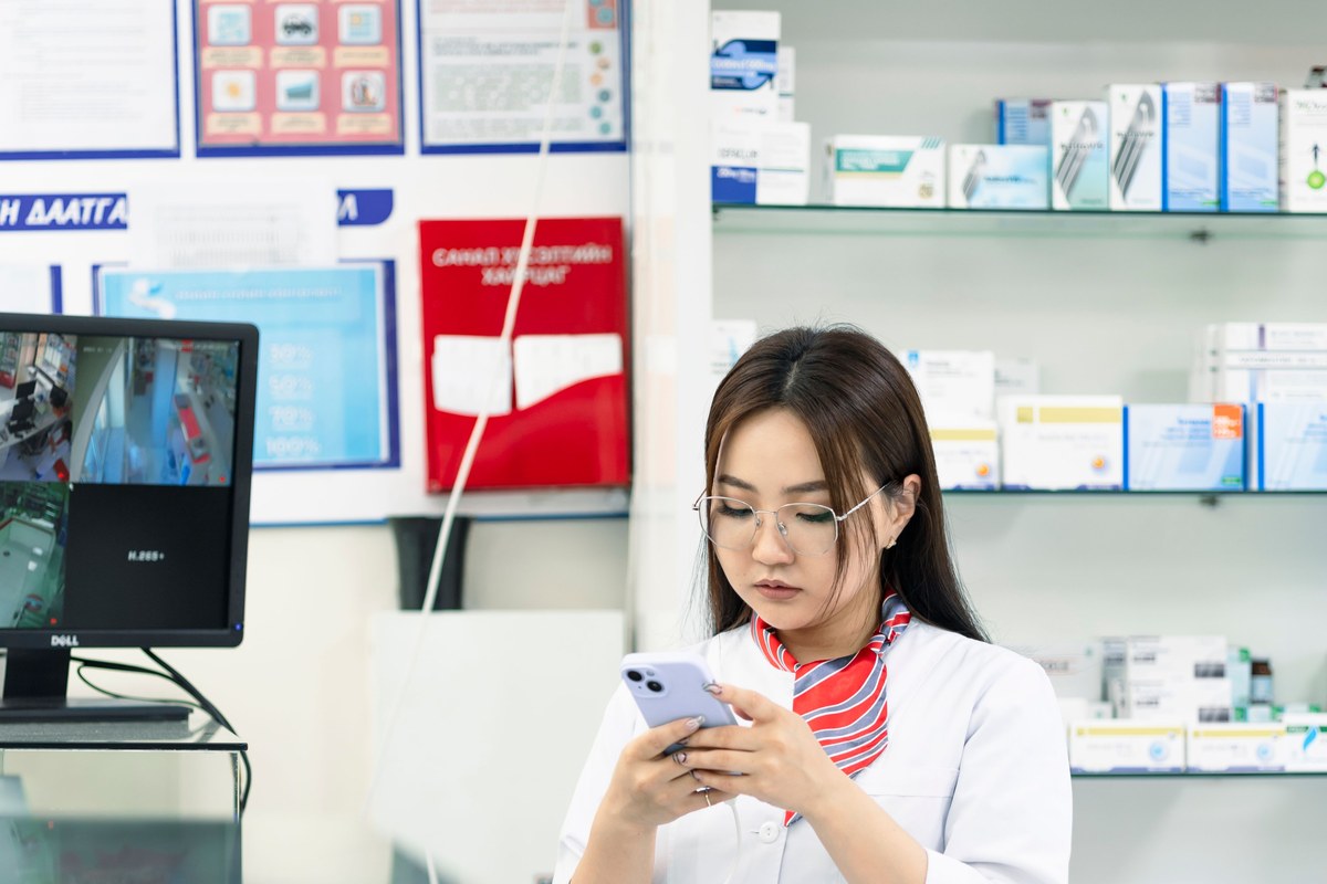 Pharmacist scanning pharmaceutical packages